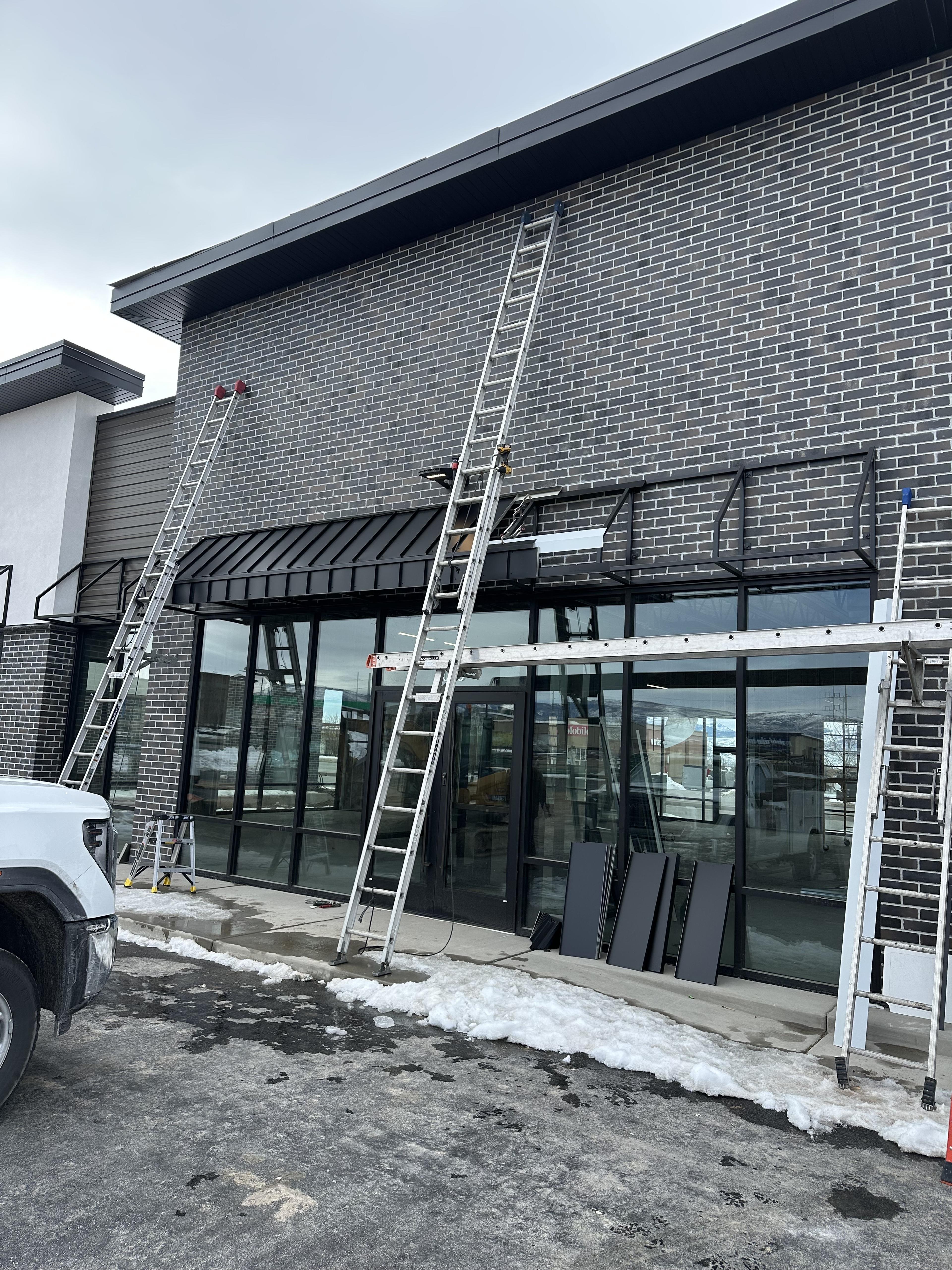 A custom metal awning installed over a home entrance.
