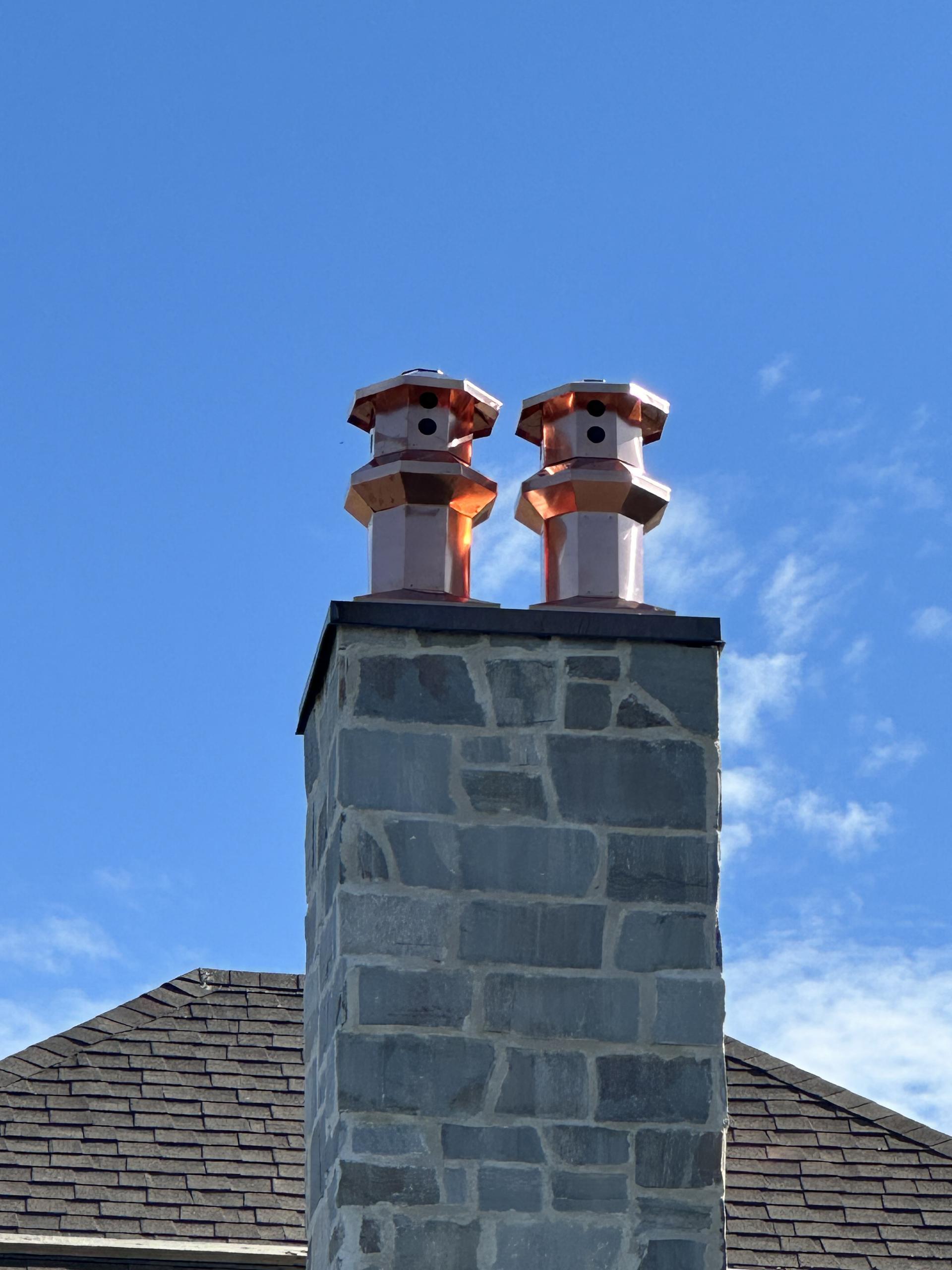 A custom bronze chimney cap crafted and installed by Joe.
